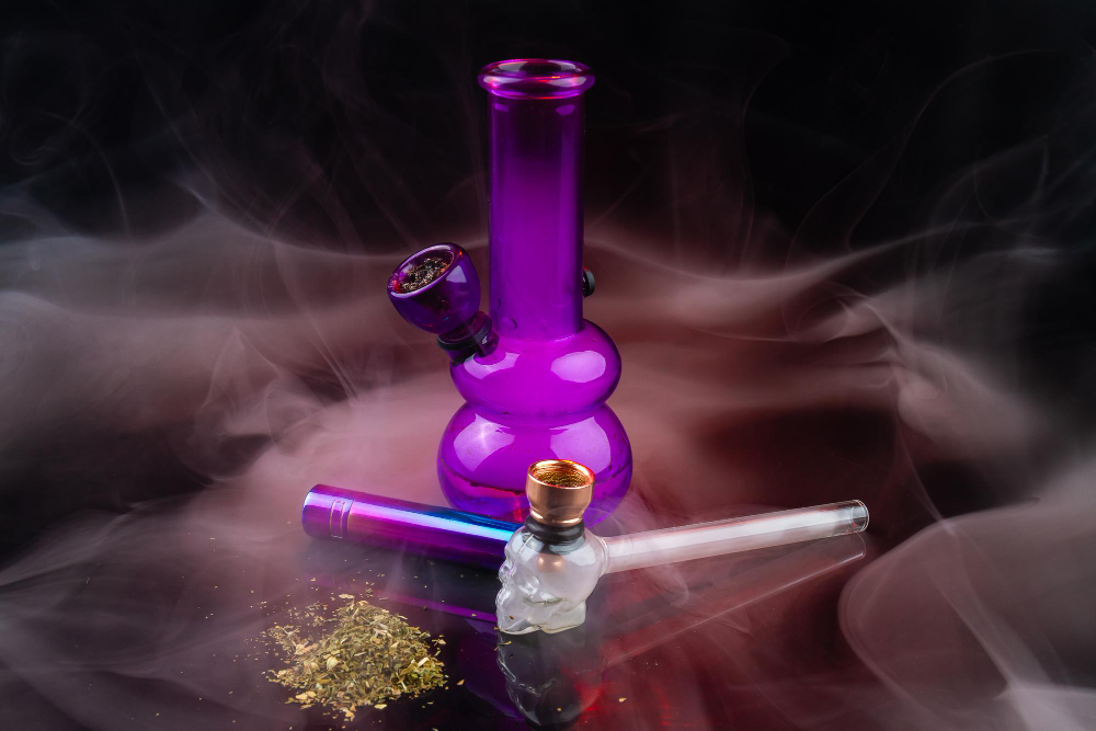 purple glass bong with pipe pile weed drug tools marijuana use How to Clean Cannabis Gear